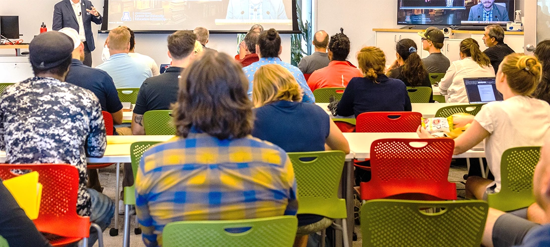 University of Arizona faculty and staff listening to a CUES presentation in ENR2, Room N595.