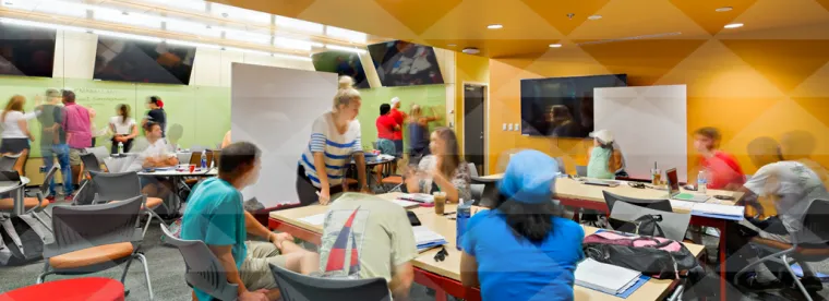 Photo of teaching/learning assistants in a classroom